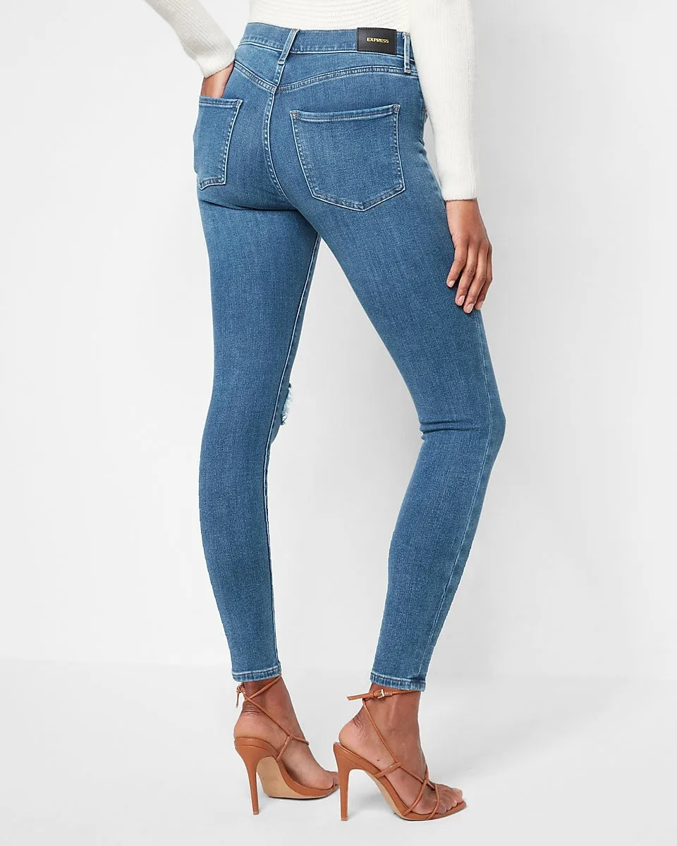 Mid Rise 4-Way Hyper Stretch Medium Wash Ripped Skinny Jeans in Medium Wash